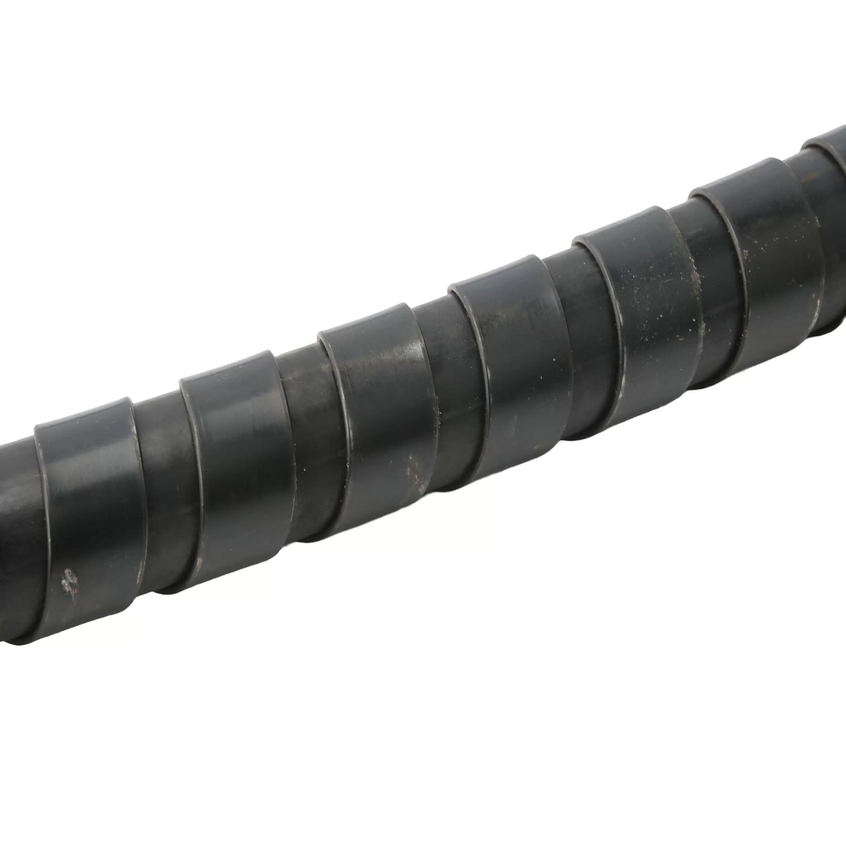 Macro close-up view of the interlocking black steel spiral ribbon coil wrapped around the flexible drive shaft casing, engineered to absorb high torsional friction and block internal cable buckling under heavy loads.