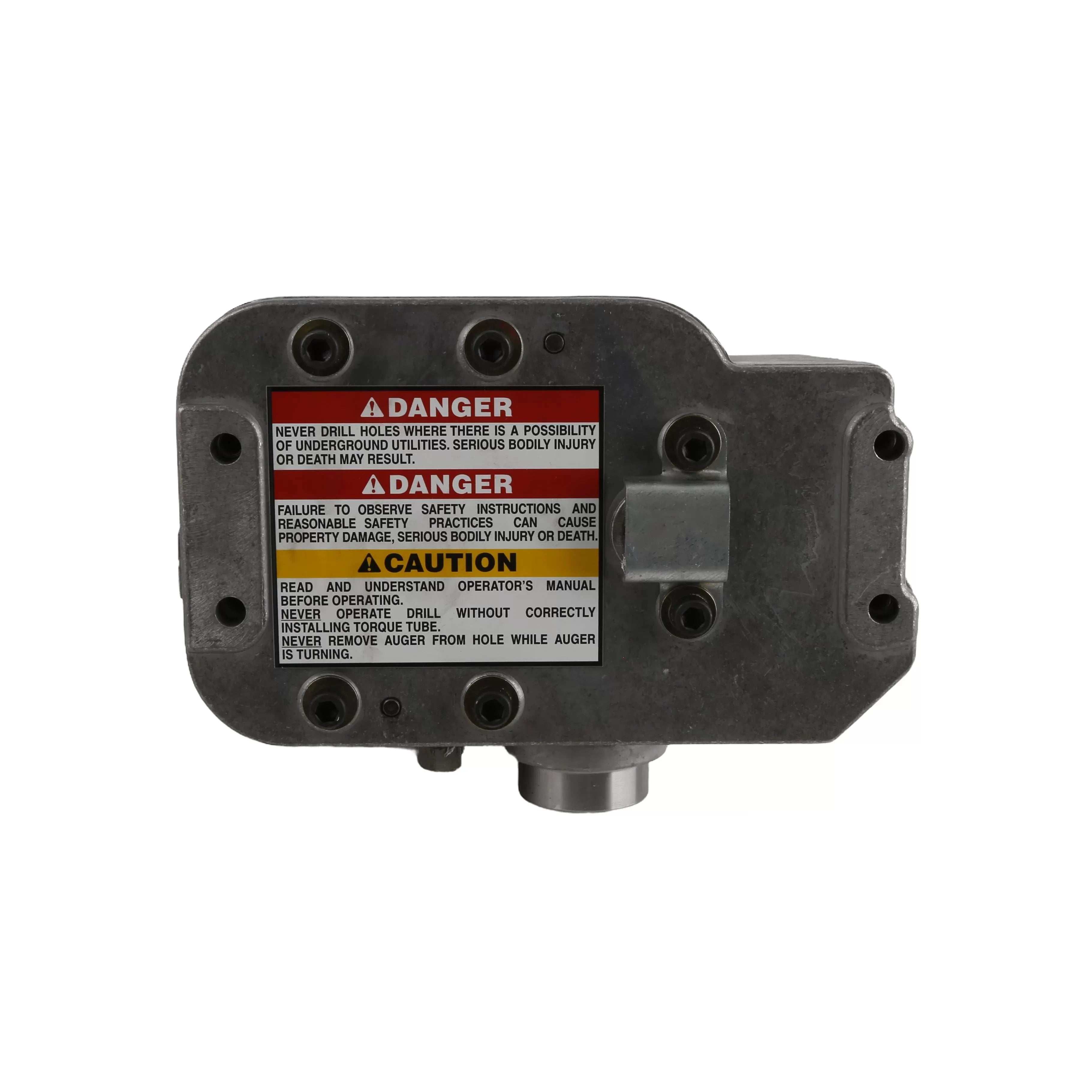Direct bottom view of the transmission housing base plate displaying security bolts and operational hazard decals. Text blocks contain prominent Danger and Caution warnings regarding underground utility hazards and proper torque arm installation.