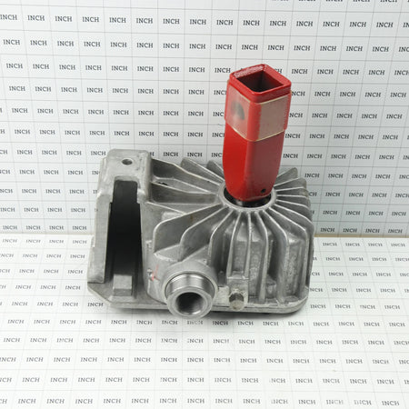 Technical sizing product photograph of the Little Beaver 10010-L 10:1 transmission positioned on an engineering grid matrix marked with one-inch scaling increments for precise physical dimension reference.