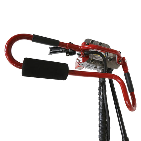 A close-up view of the ergonomic operator handles on the Little Beaver gas earth drill machinery, emphasizing the padded red grip configuration, throttle controls, and robust mechanical construction.