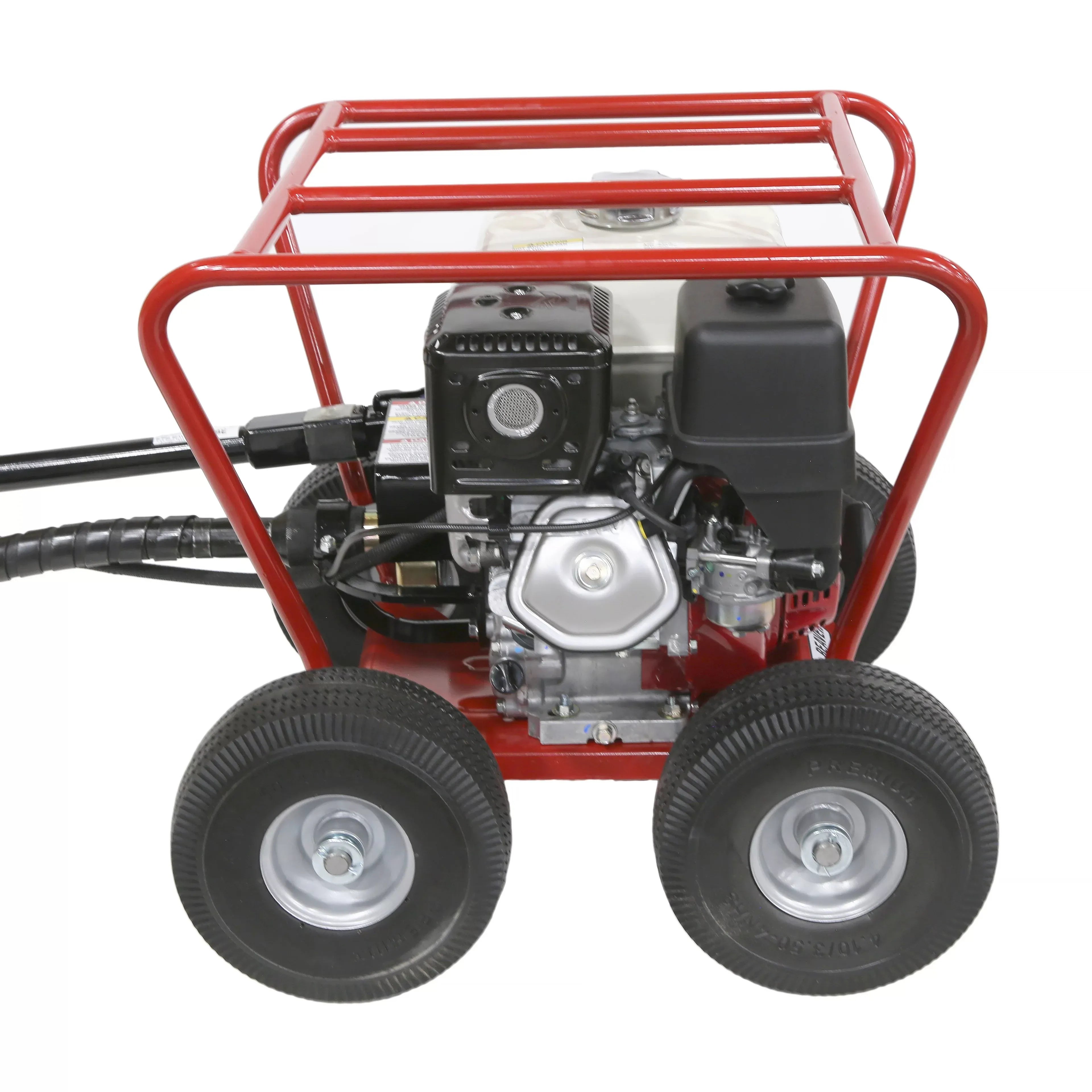 A close-up view of the commercial Honda engine and carburetor assembly on the Little Beaver earth drill power head machine, emphasizing heavy-duty components and all-terrain wheels.