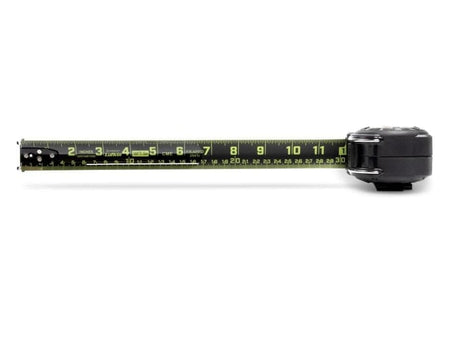 A top-down studio shot of the Lufkin Shockforce G2 tape measure. The black and green Nite Eye blade is extended horizontally, showing both SAE (inches) and metric (centimeters) markings.