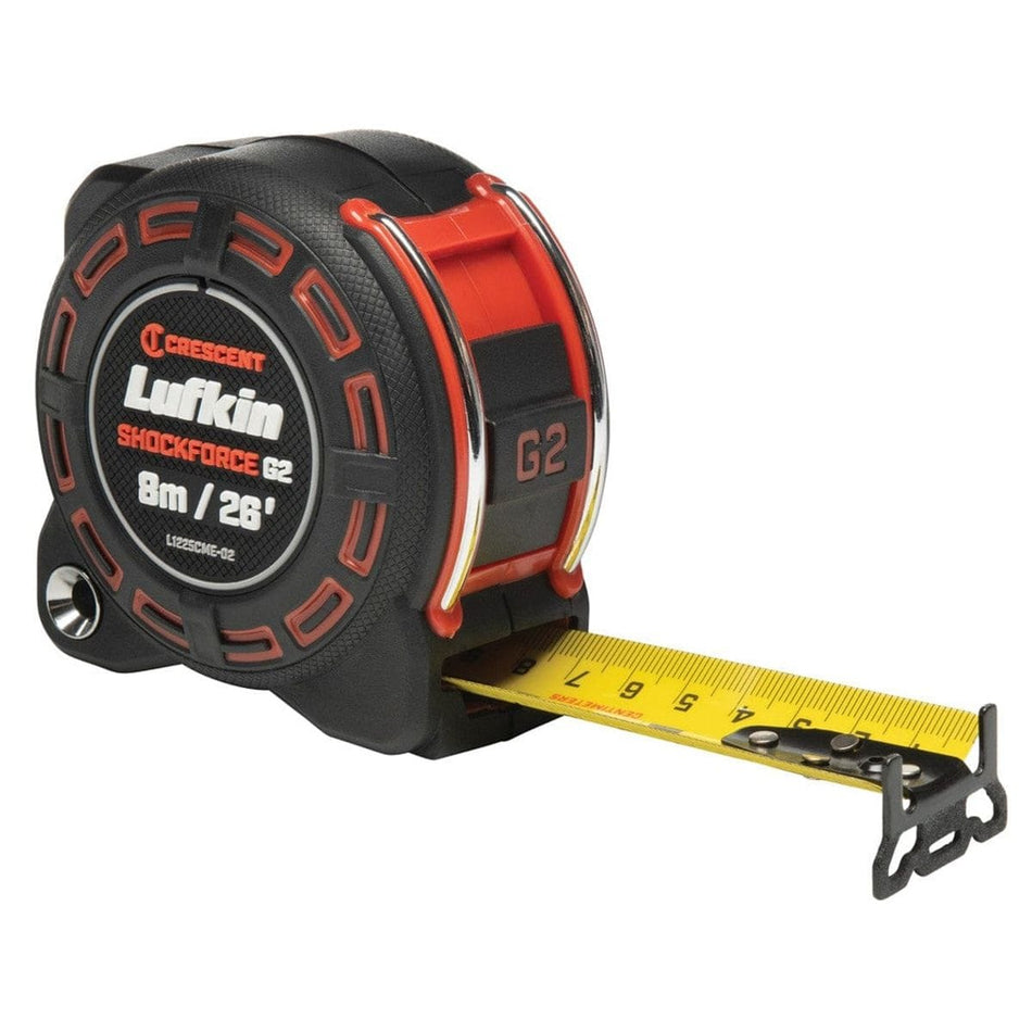 A three-quarter studio shot of the Lufkin Shockforce G2 8m/26' tape measure (L1225CME-02) with the yellow dual-sided blade partially extended, showing SAE and metric markings.