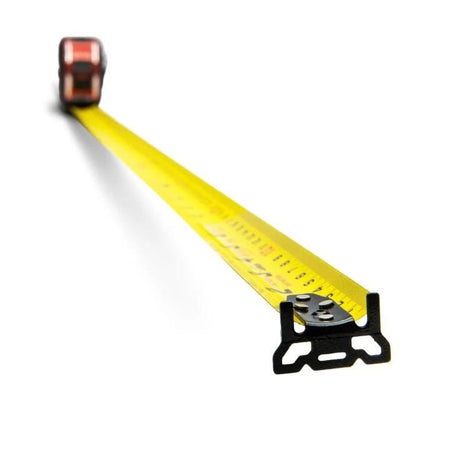 A low-angle studio shot of the Lufkin Shockforce G2 tape measure with its yellow dual-sided blade extended, highlighting the non-magnetic, diamond-coated end hook.