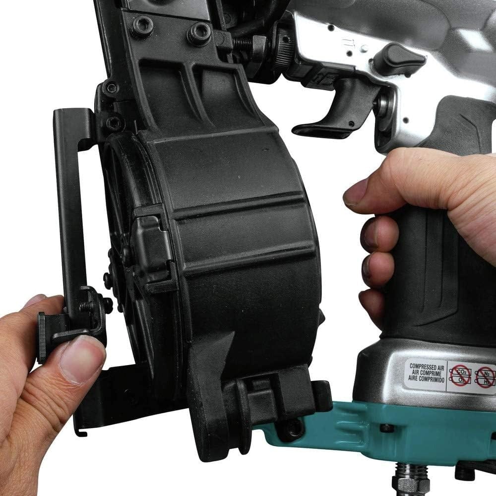 A close-up action shot of a hand adjusting the tool-less shingle guide on the Makita AN454 roofing nailer.