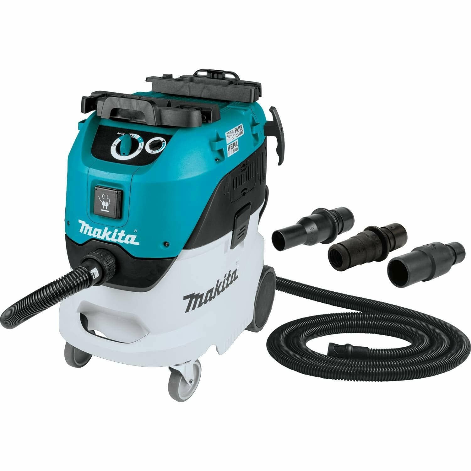 Makita VC4210L wet/dry dust extractor vacuum with teal and white body, mounted on wheels, shown with hose and multiple nozzle attachments arranged around the unit.