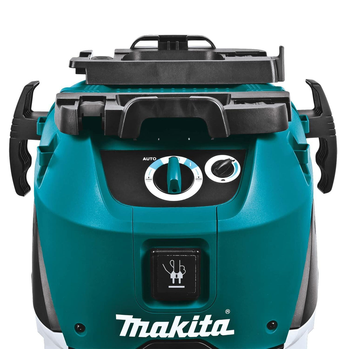 Close-up of Makita VC4210L vacuum control panel with rotary switch and power tool connection port, highlighting operational modes and tool sync capability.