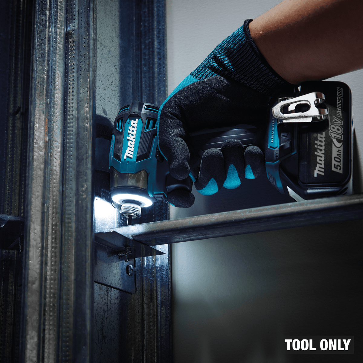 Makita XDT20 impact driver driving fasteners into steel framing channels using illuminated shadowless LED light ring.