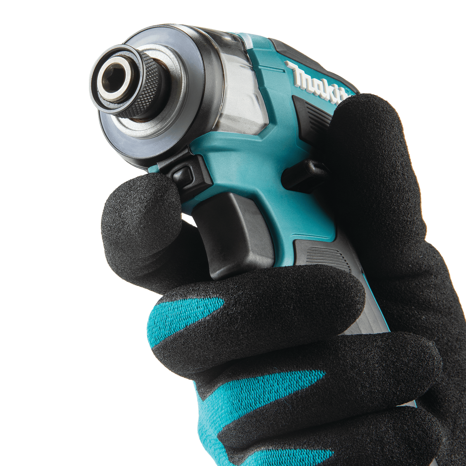 Operator depressing the one-touch speed selector button below the 1/4-inch hex chuck on the Makita XDT20 impact driver.