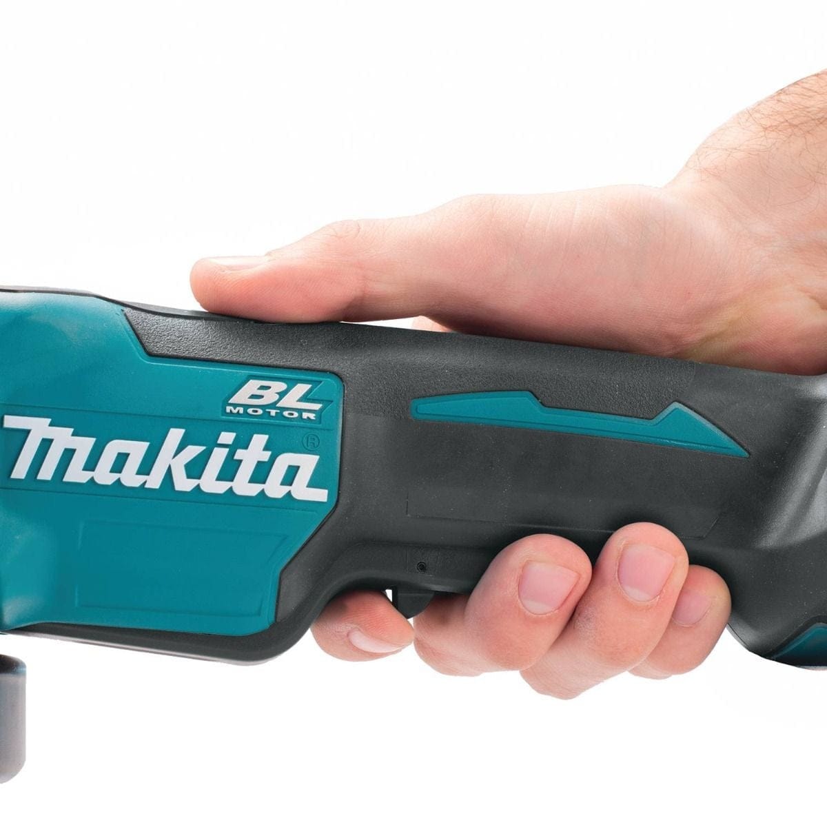A close-up of a hand gripping the ergonomic black rubber handle of the Makita XAG11Z angle grinder to demonstrate its grip.