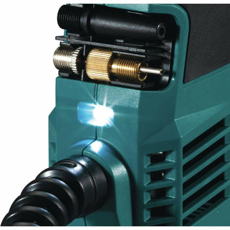 Close-up of teal rotary tool with LED light and multiple bits stored onboard; flexible shaft attachment connected for precision work.