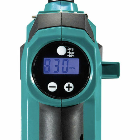 Digital pressure gauge on Makita inflator displaying 830 kPa; selector switch set to kilopascals with plus and minus buttons below screen.