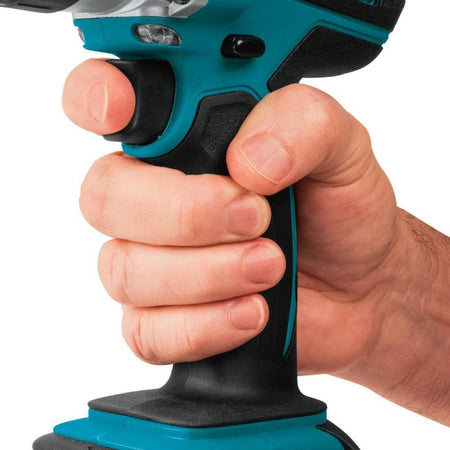 Hand holding a blue and black power tool against a white background