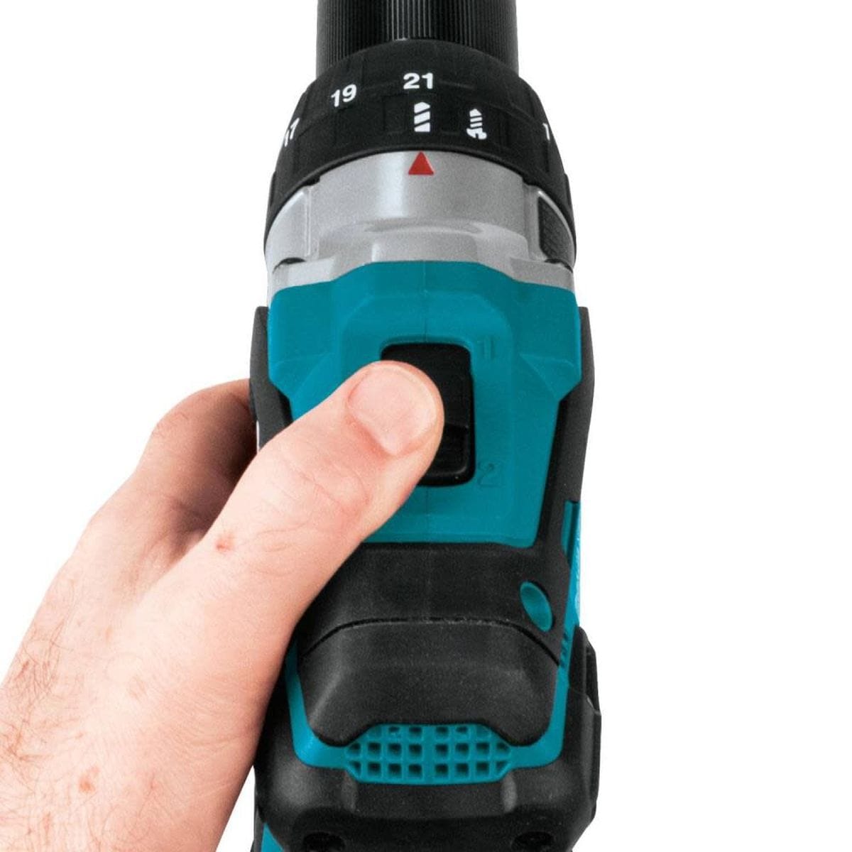 Hand holding a cordless drill with a focus on the trigger and dial.