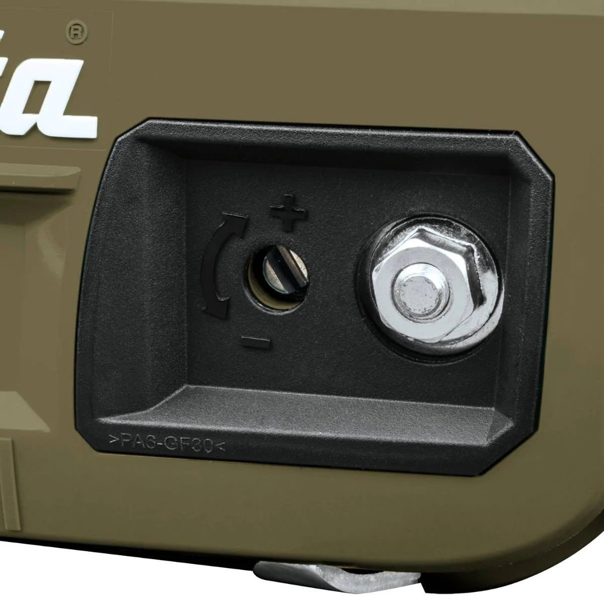 Detailed view of the lateral chain tensioning system and captured bar nut on the Makita Outdoor Adventure saw, allowing for easy field maintenance and adjustment.