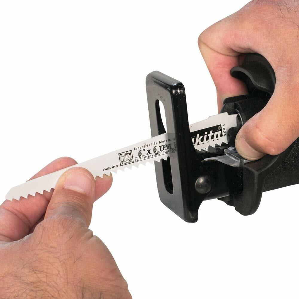 A person demonstrating the tool-less blade change feature on the Makita reciprocating saw by inserting a new blade.