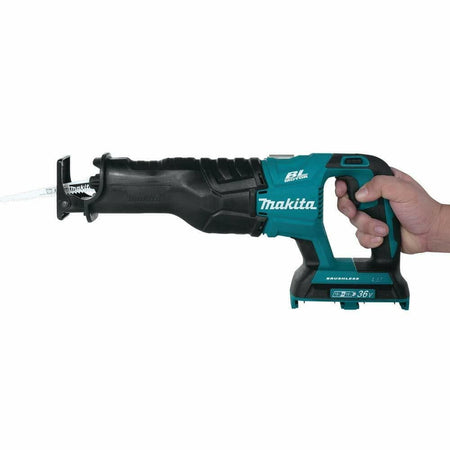A hand holding the Makita XRJ06Z reciprocating saw to demonstrate its size and ergonomic grip.