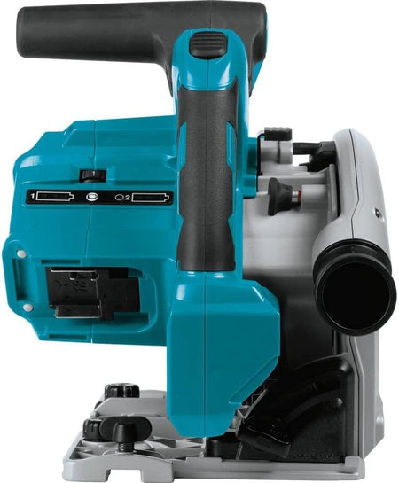 Side view of Makita XPS01Z plunge circular saw showing teal and black handle, partially enclosed blade, and rear dust extraction port. Base plate includes adjustment knobs for depth and angle. Cordless design with battery compartment visible. Ideal for precision cuts in woodworking and jobsite use.