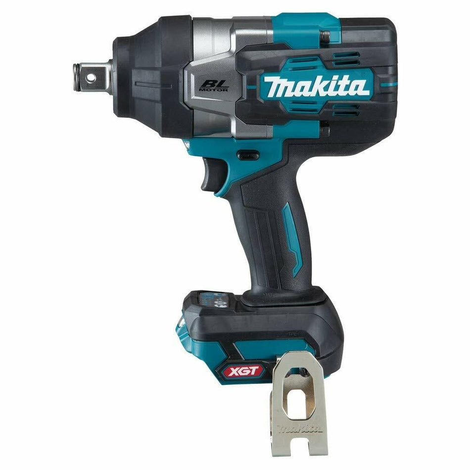 Makita XGT impact wrench with BL Motor and 40V Max battery; shown with metal belt clip accessory in front, designed for heavy-duty fastening tasks.