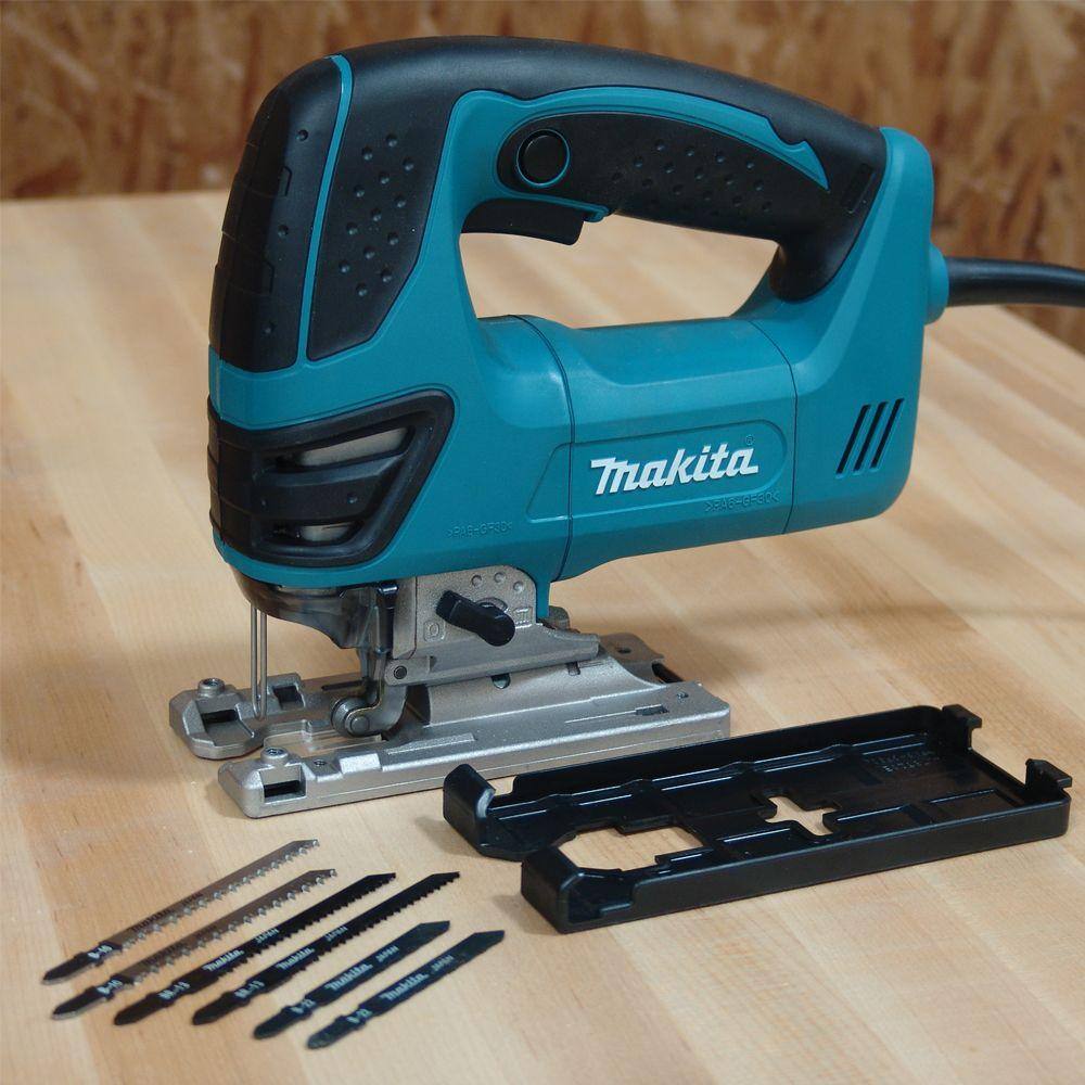 Front angled view of the Makita top handle power saw highlighting the built-in LED light and the tool-less blade change lever for fast, wrench-free T-shank blade installations.