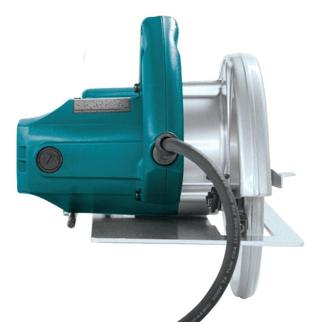 A top-down studio shot of the motor side of the Makita 5007F circular saw, showing the teal motor housing, rear handle, and power cord.