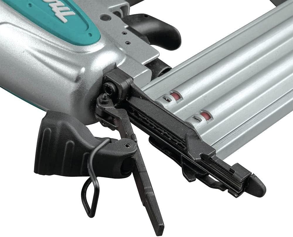 A detailed close-up of the narrow nose and tool-free jam release latch on the Makita AF506 brad nailer.
