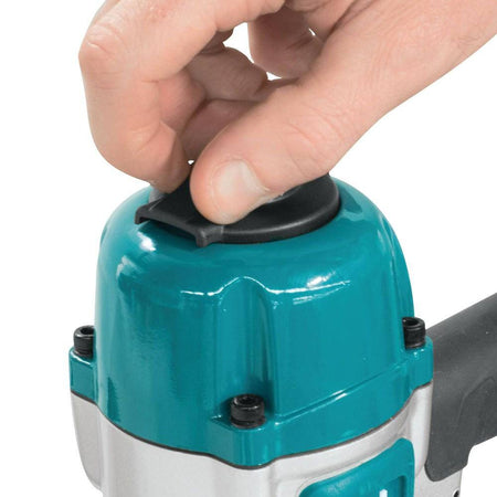 Detailed view of the 2-mode selector switch on the Makita AF601 pneumatic straight finish nailer, offering quick control over single sequential or contact bump nailing operations.
