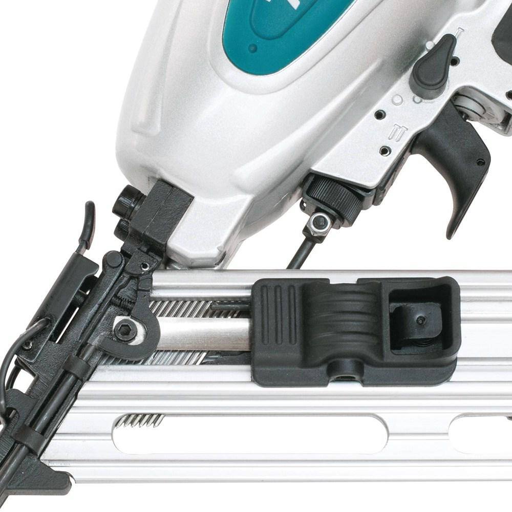 Close-up of a nail gun with a white background