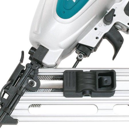 Close-up of a nail gun with a white background