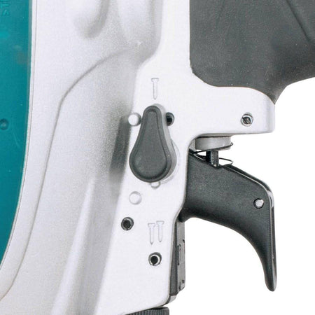 Detailed view of the nail lock-out window on the Makita AF635 34-degree angled magazine, designed to alert the user to reload finish nails and prevent damaging dry-fires.