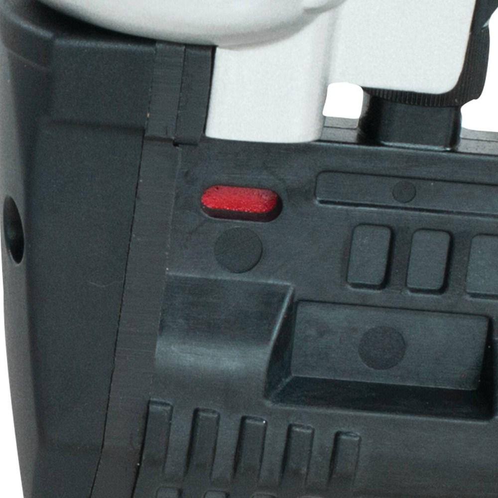 Close-up of the red staple reload indicator window on the magazine of the Makita AT638A crown stapler, designed to prevent dry-fires.