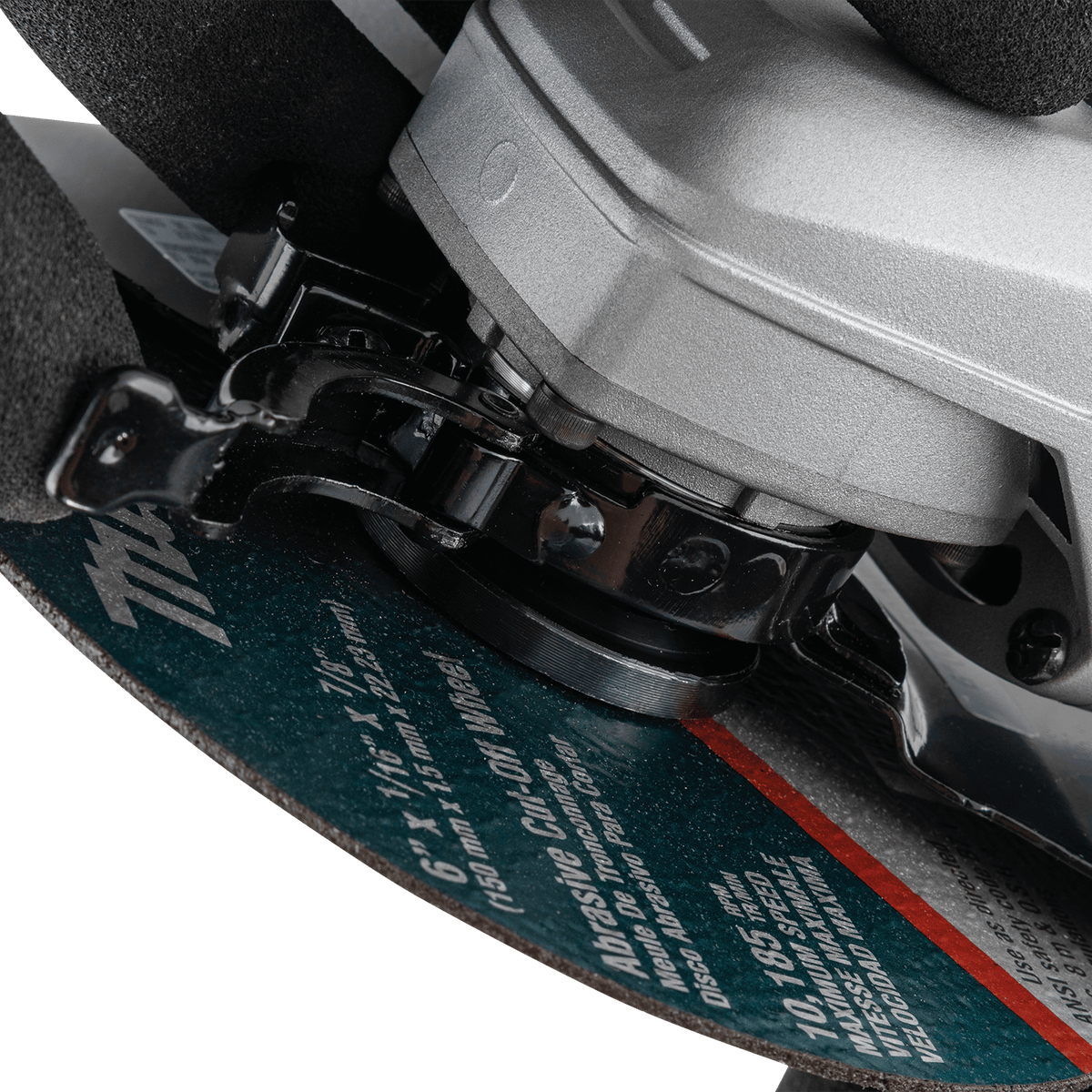 Close-up view of the SJS mechanical clutch and drive system on the Makita grinder protecting gears from wheel binding.
