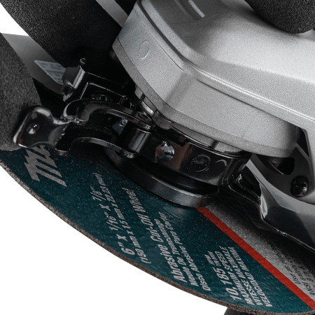 Close-up view of the SJS mechanical clutch and drive system on the Makita grinder protecting gears from wheel binding.