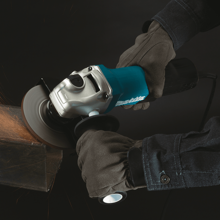 Welder preparing a thick metal joint edge using the Makita GA4553R 4-1/2-inch corded paddle switch angle grinder.