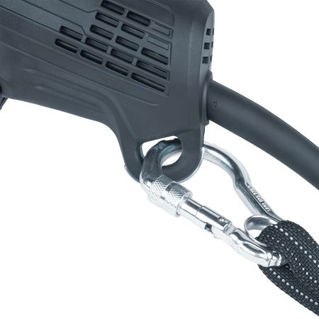 Steel carabiner safety lanyard attached to the integrated tethering loop on the base of the Makita GA4553R angle grinder.