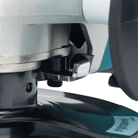 Close-up of the spring-loaded tool-less guard release latch mounted to the cast aluminum gear case of the Makita GA5052 grinder.