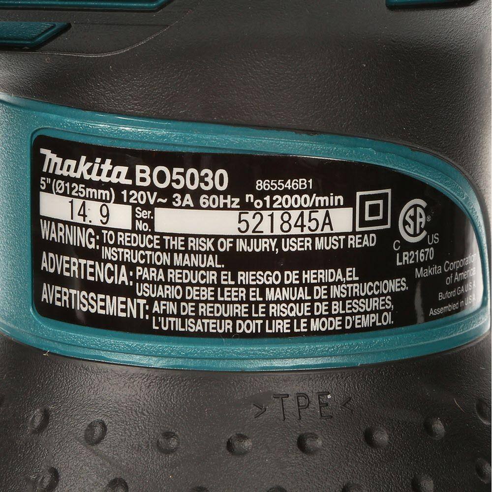 Close-up of a Makita tool with a label showing model number and specifications.