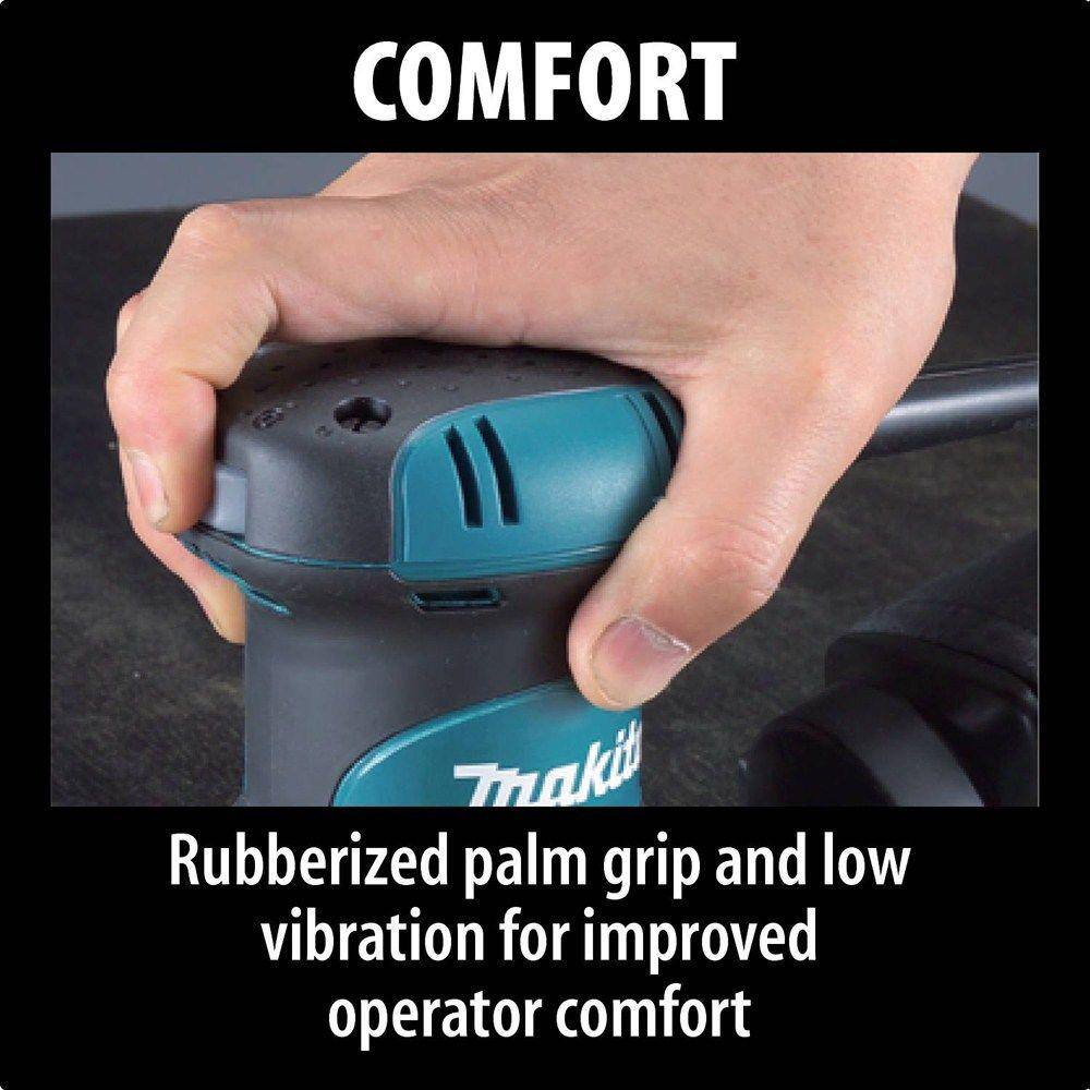 Hand holding a Makita power tool with text highlighting comfort features