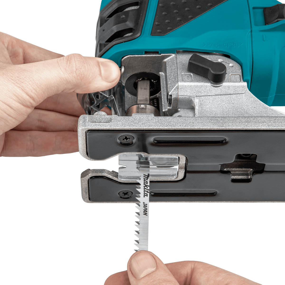 Demonstration of the spring-loaded tool-less blade ejection lever on the Makita 4351FCT jig saw for rapid T-shank blade changes.