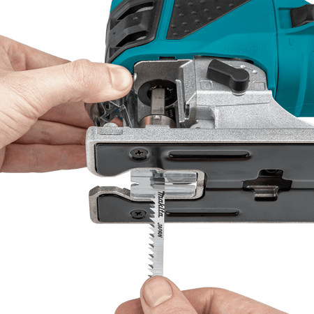Demonstration of the spring-loaded tool-less blade ejection lever on the Makita 4351FCT jig saw for rapid T-shank blade changes.