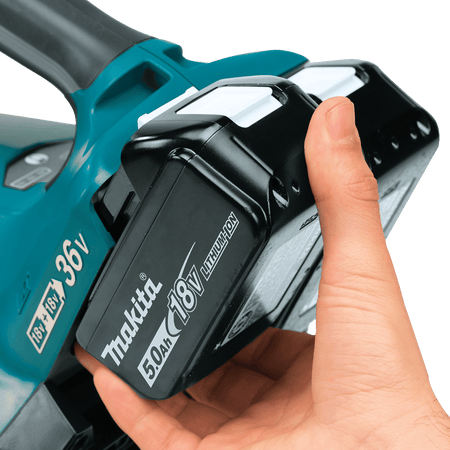 Close-up of the dual battery terminal housing on the Makita XBU02 36V handheld blower accepting two 18V LXT lithium-ion batteries.