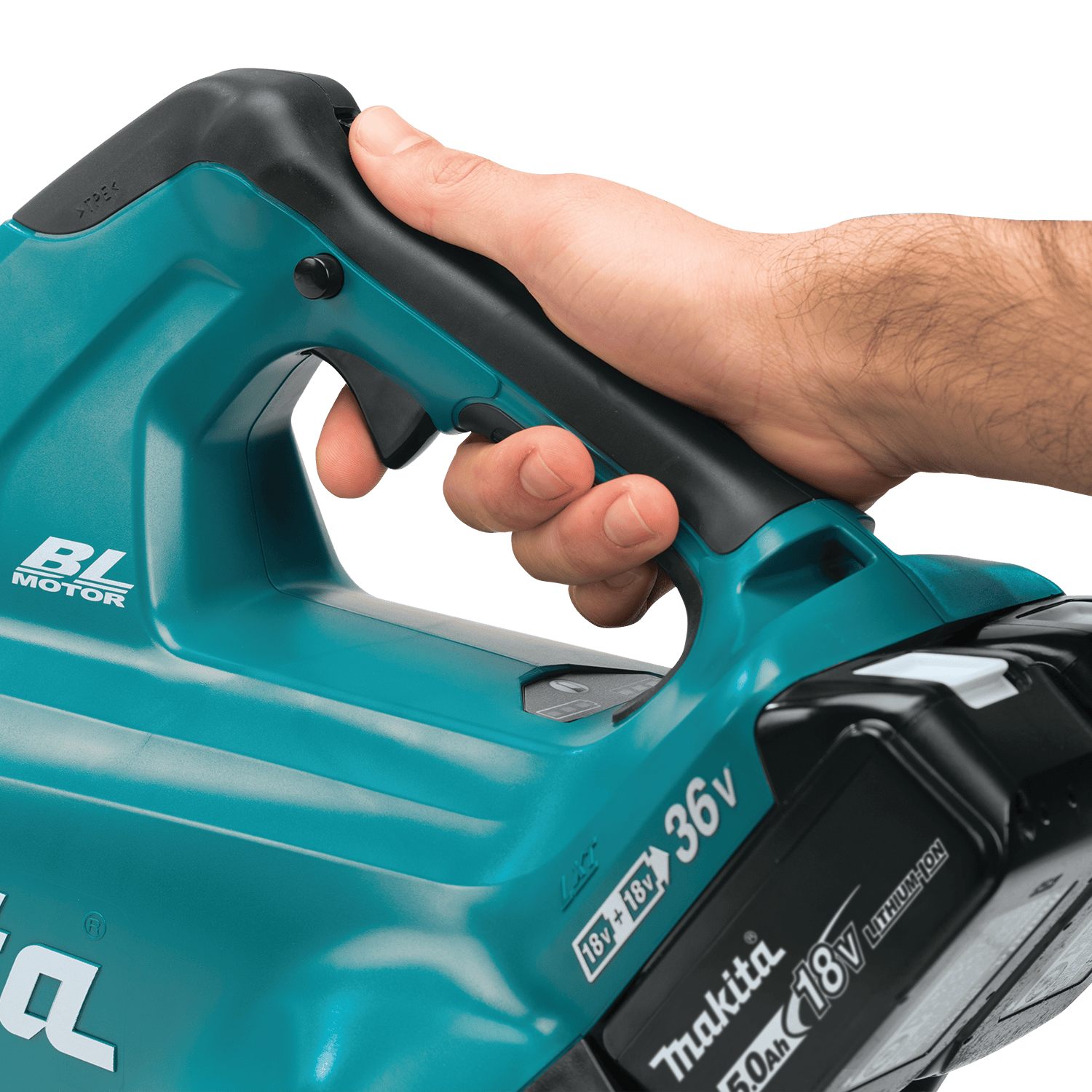 Operator holding the ergonomic soft-grip handle of the Makita XBU02 36V blower equipped with an 18V LXT 5.0Ah lithium-ion battery.