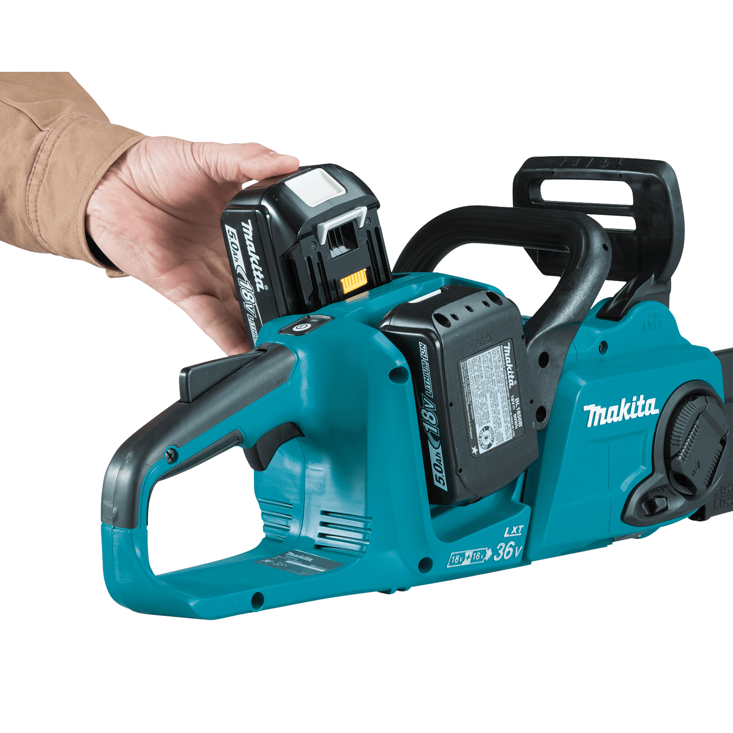 Hand loading an 18V LXT 5.0Ah lithium-ion battery into the dual battery receptacle of the Makita XCU04 36V cordless chainsaw.