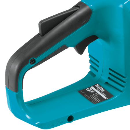 Close-up of the ergonomic rear handle assembly, lock-off safety lever, and variable speed trigger on the Makita XCU04 chainsaw.