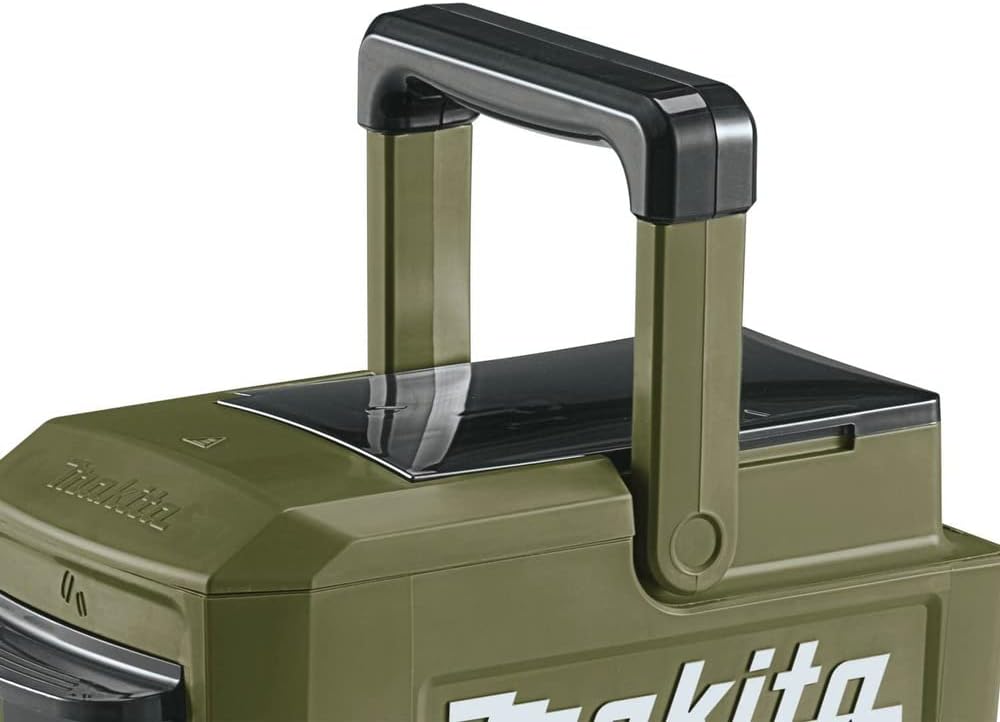Top view of the Makita ADCM501Z cordless coffee maker highlighting the extended folding top transport handle for jobsite mobility.