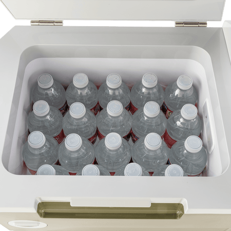 Top-down view inside the 21-quart Makita ADCW180Z cooler filled with twenty 16.9-ounce water bottles to demonstrate storage capacity.