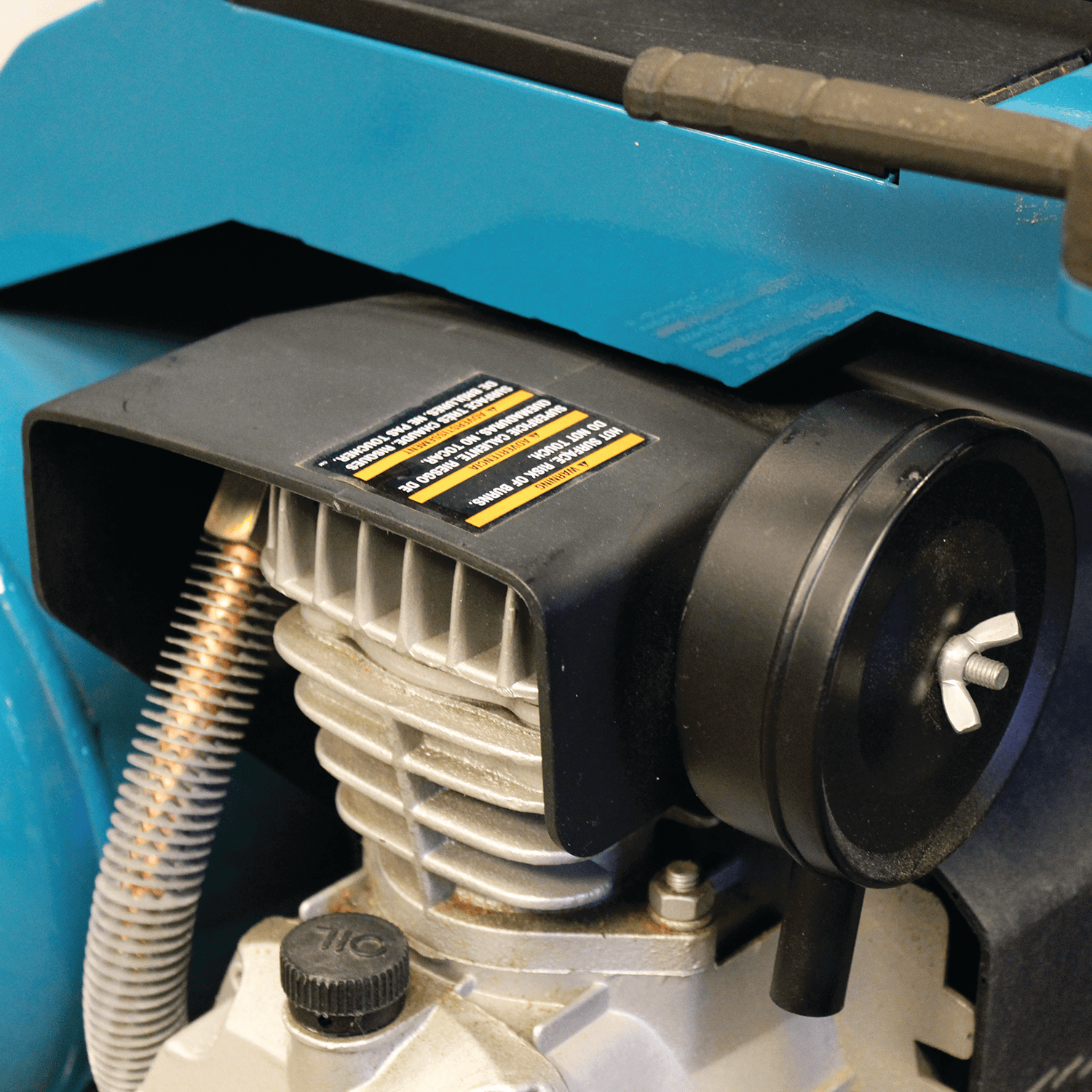 Makita MAC5200 roll-cage frame with folded handle, dual pressure gauges, regulator knob, and dual air couplers.