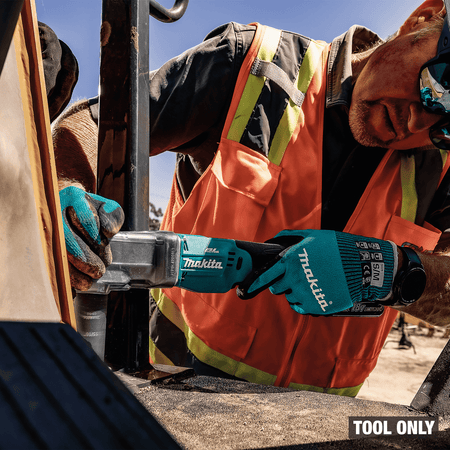 Heavy equipment mechanic tightens machinery bolts in confined spaces using the Makita 18V cordless angle impact wrench.