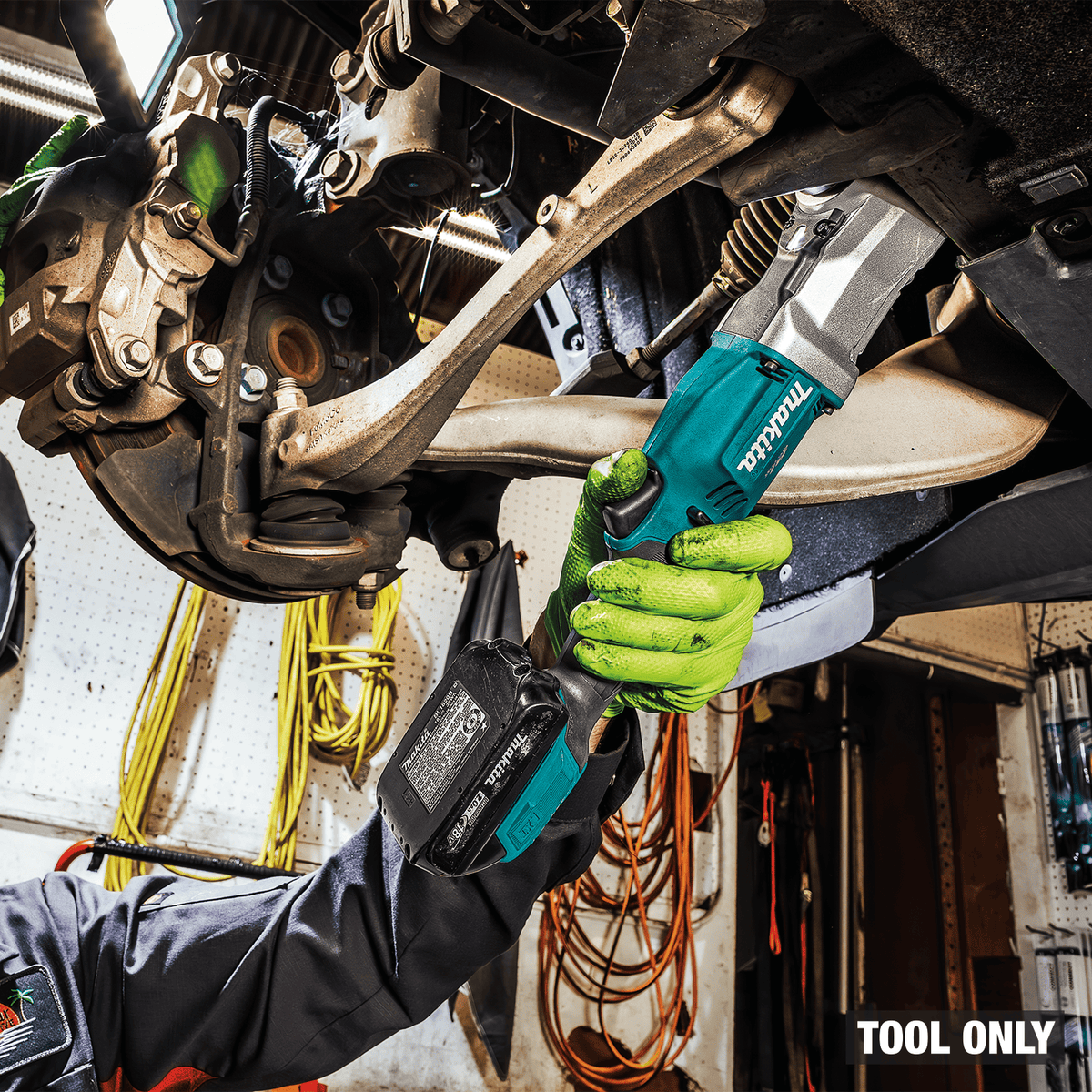 Low-profile right-angle head on the Makita XLT03Z impact wrench reaches tight suspension bolts past vehicle control arms.