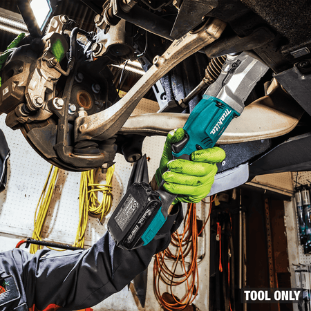 Low-profile right-angle head on the Makita XLT03Z impact wrench reaches tight suspension bolts past vehicle control arms.